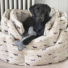 Load image into Gallery viewer, Made from canvas, this bone shaped dog toy is bound to be a hit with any pooch - especially those who love squeakers!
