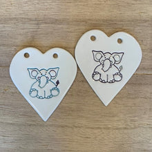 Load image into Gallery viewer, This sweet handmade ceramic heart, featuring a loving elephant, makes a lovely birthday, christening or newborn gift.
