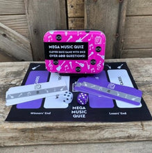 Load image into Gallery viewer, A fun quiz game where the roll of the dice dictates the questions.  In this tiny tin there are over 600 questions on the best music and performers across all the genres.  From rock to pop, jazz to blues, even opera to disco!

